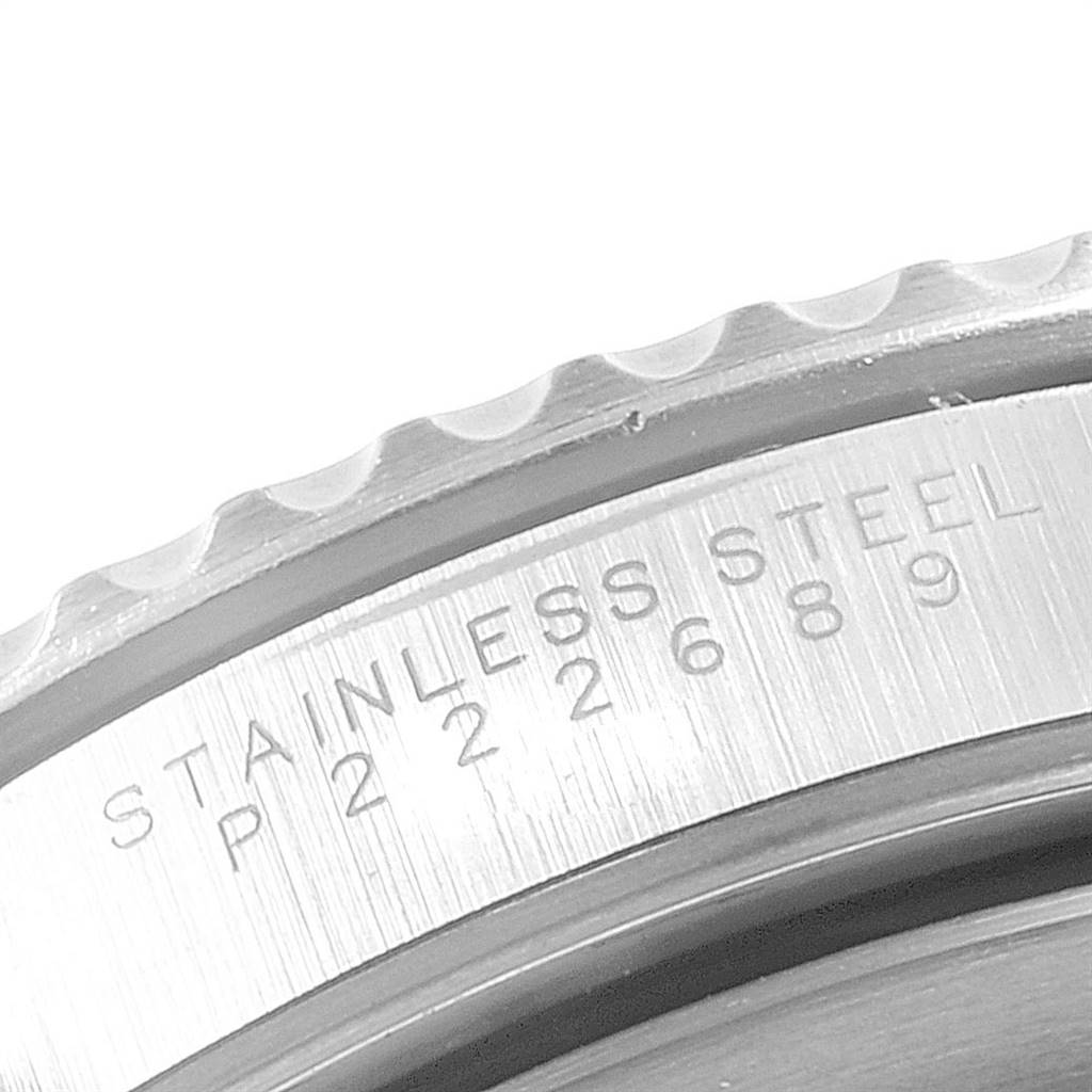 The image shows a close-up of the stainless steel case and serial engraving of a Rolex Submariner 14060 Men's Stainless Steel Black Dial 14060 Men's Stainless Steel Black Dial watch.