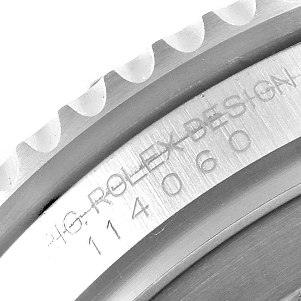 This close-up image displays the engraved inner bezel and outer bezel teeth of the Rolex Submariner 114060 Men
s Stainless Steel Black Dial 114060 Men
s Stainless Steel Black Dial watch.