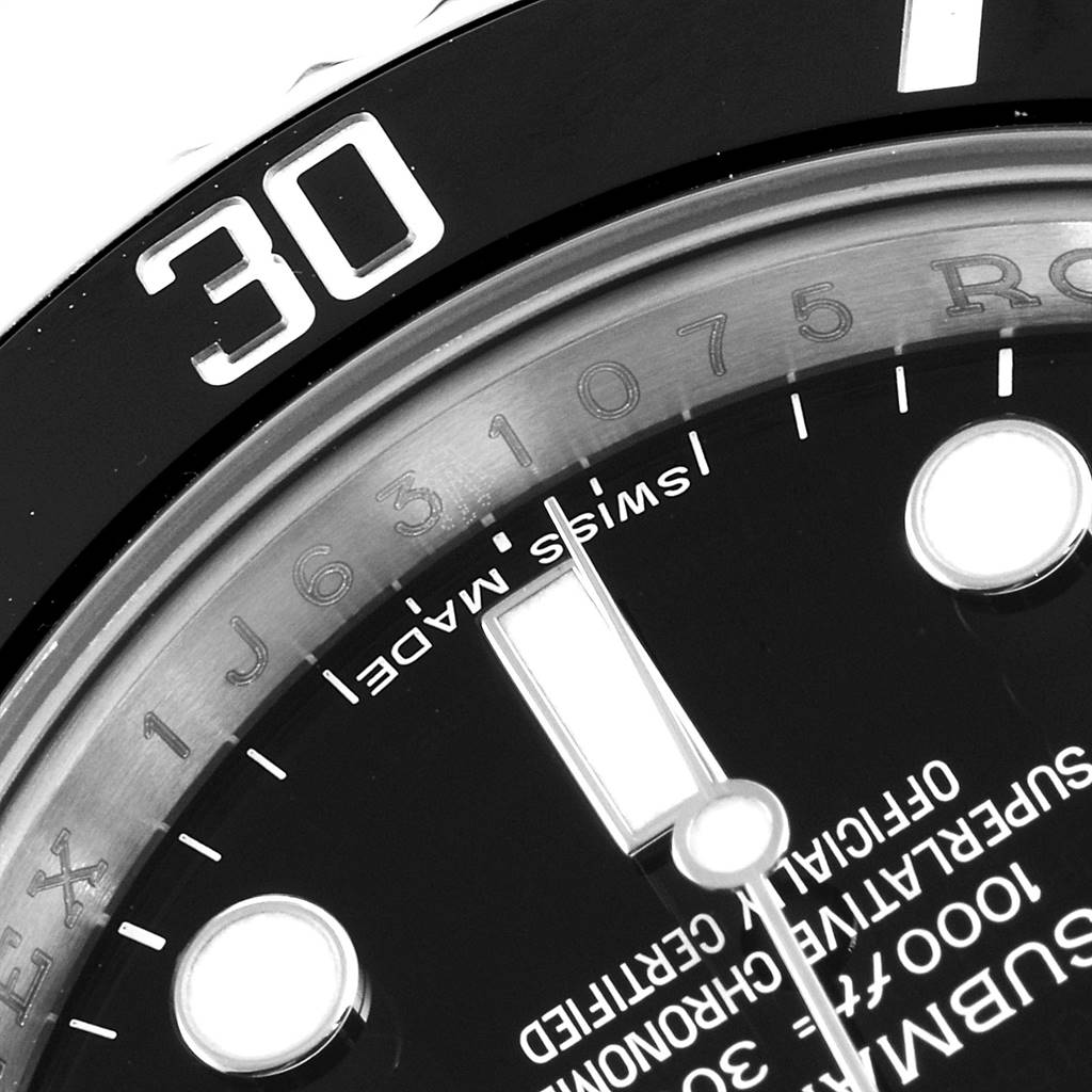 The close-up image shows the bezel, part of the dial, and hour markers of a Rolex Submariner 114060 Men
s Stainless Steel Black Dial 114060 Men
s Stainless Steel Black Dial watch.