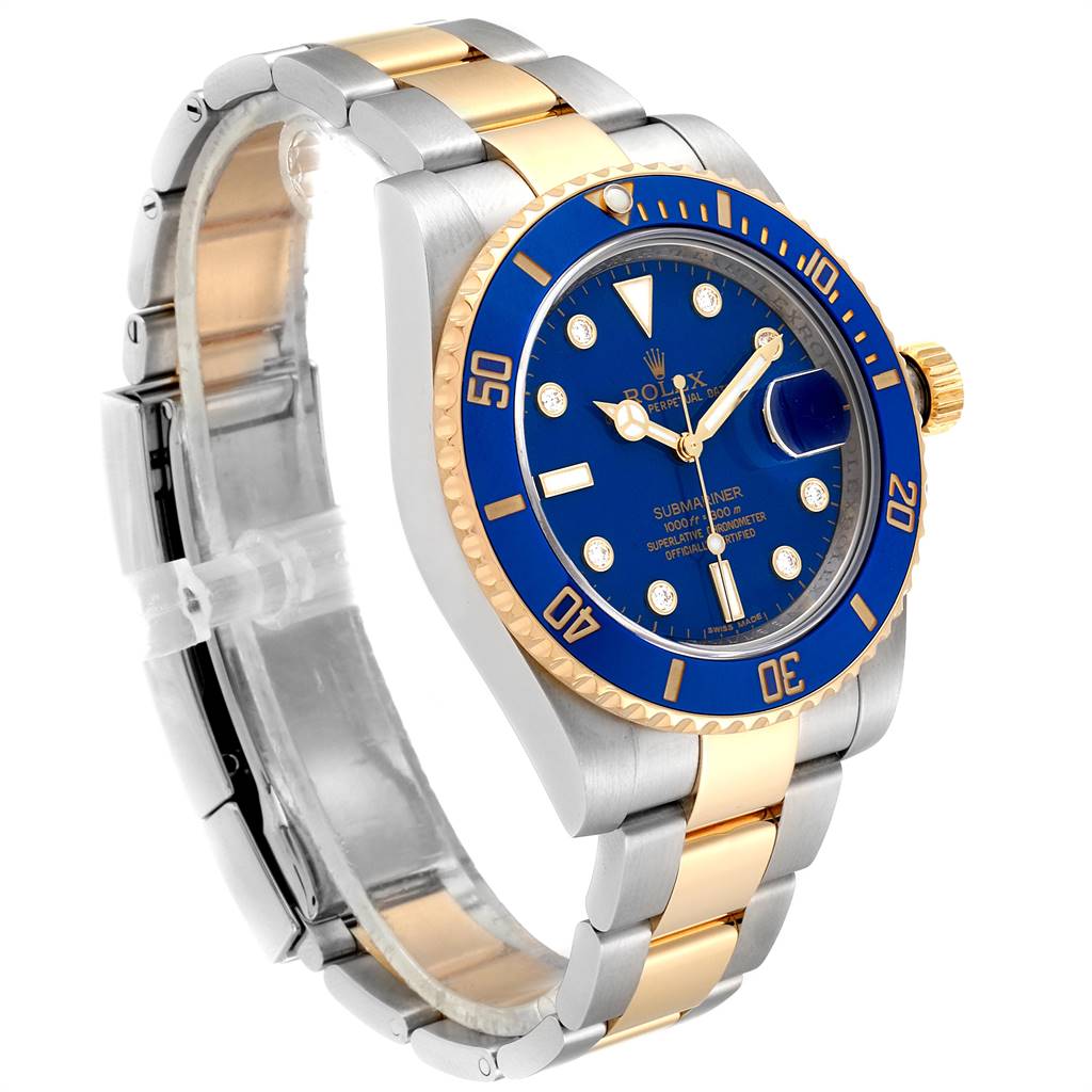 The image shows a Rolex Submariner 116613 Men
s Steel and Gold (two tone) Blue Dial 116613 Men
s Steel and Gold (two tone) Blue Dial watch at an angled side view, highlighting the blue dial, bezel, and two-tone band.