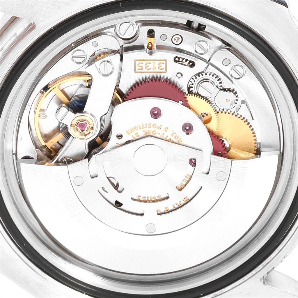 This image shows a close-up view of the internal mechanical movement of a Rolex Submariner 116610LV Men
s Stainless Steel Green Dial 116610LV Men
s Stainless Steel Green Dial watch.