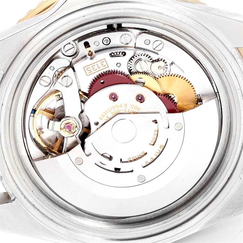 The image shows the internal movement mechanism parts of a Rolex Submariner 16613 Men's Steel and Gold (two tone) Blue Dial 16613 Men's Steel and Gold (two tone) Blue Dial watch from an opened case-back angle.