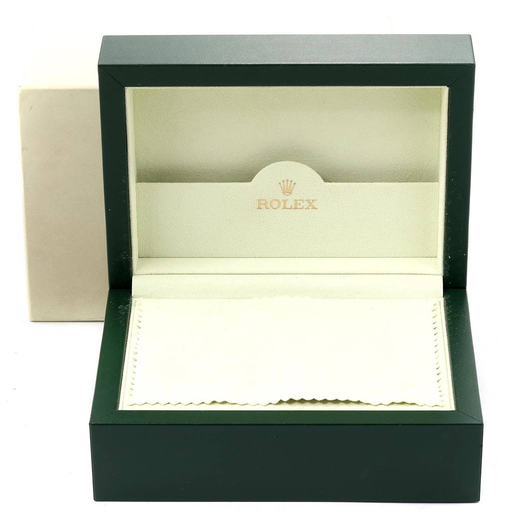 This image shows an open Rolex Submariner 16613 Men's Steel and Gold (two tone) Blue Dial 16613 Men's Steel and Gold (two tone) Blue Dial watch box featuring the brand logo inside, with a cloth accessory included.