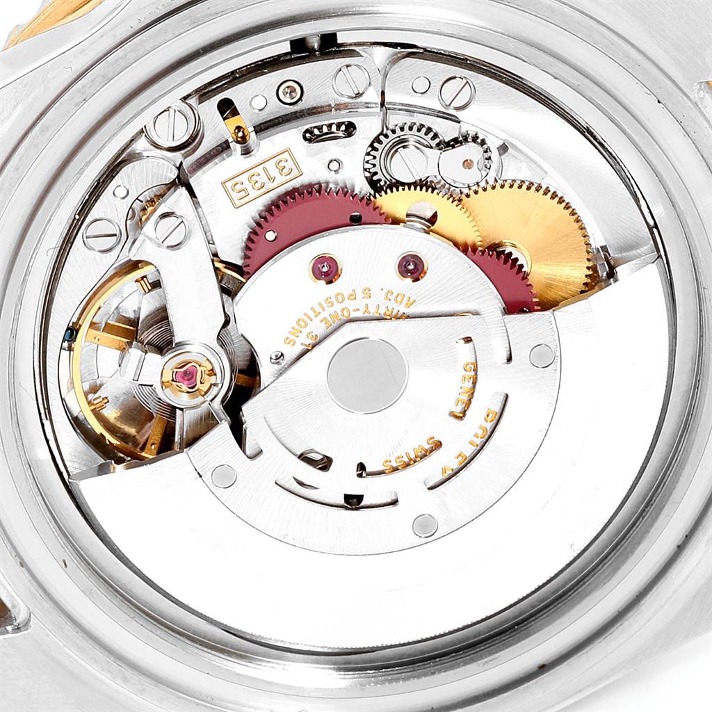 This image shows the internal mechanical movement parts of a Rolex Submariner 16613 Men's Steel and Gold (two tone) Blue Dial 16613 Men's Steel and Gold (two tone) Blue Dial watch from an open-case back angle.