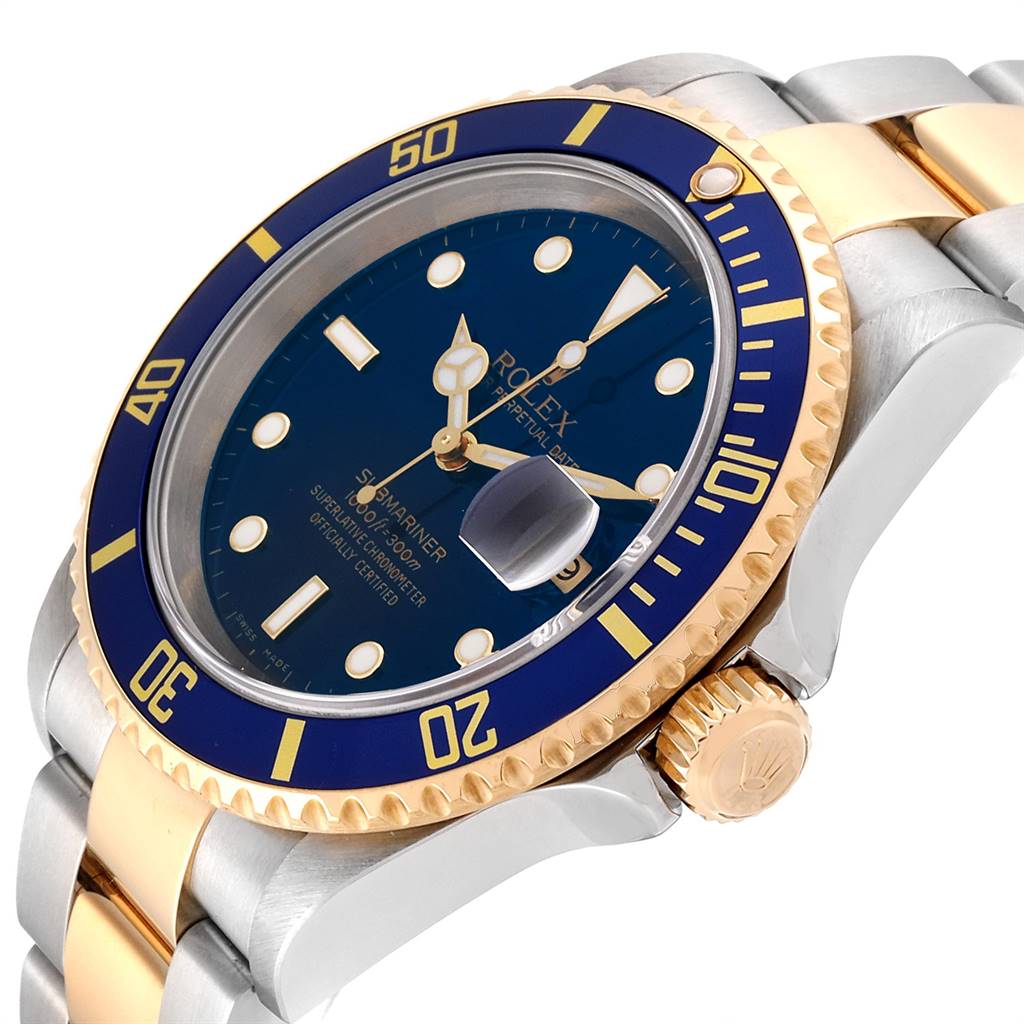 The image shows a close-up angle of the Rolex Submariner 16613 Men's Steel and Gold (two tone) Blue Dial 16613 Men's Steel and Gold (two tone) Blue Dial watch, displaying the bezel, dial, crown, and part of the bracelet.
