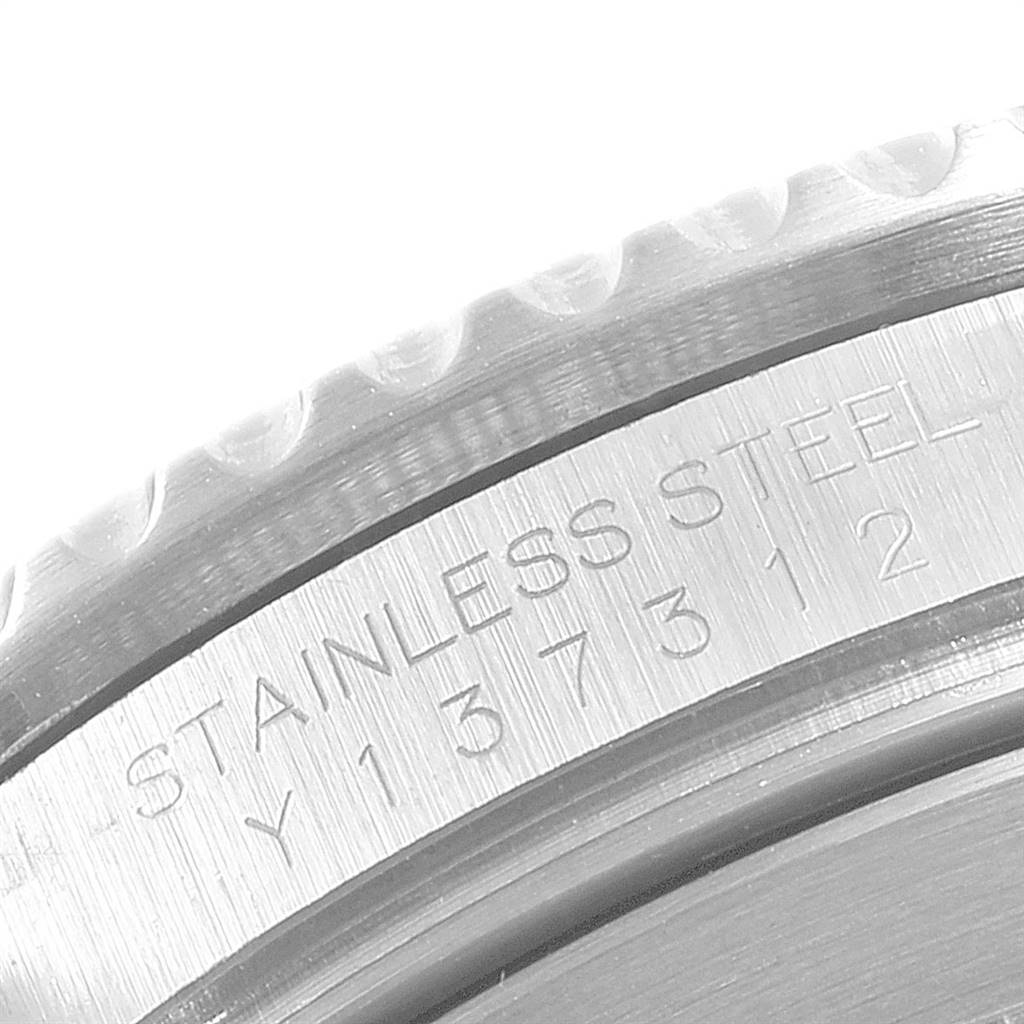 This is a close-up of the edge and engravings on the stainless steel case of a Rolex Submariner 16610 Men
s Stainless Steel Black Dial 16610 Men
s Stainless Steel Black Dial watch.