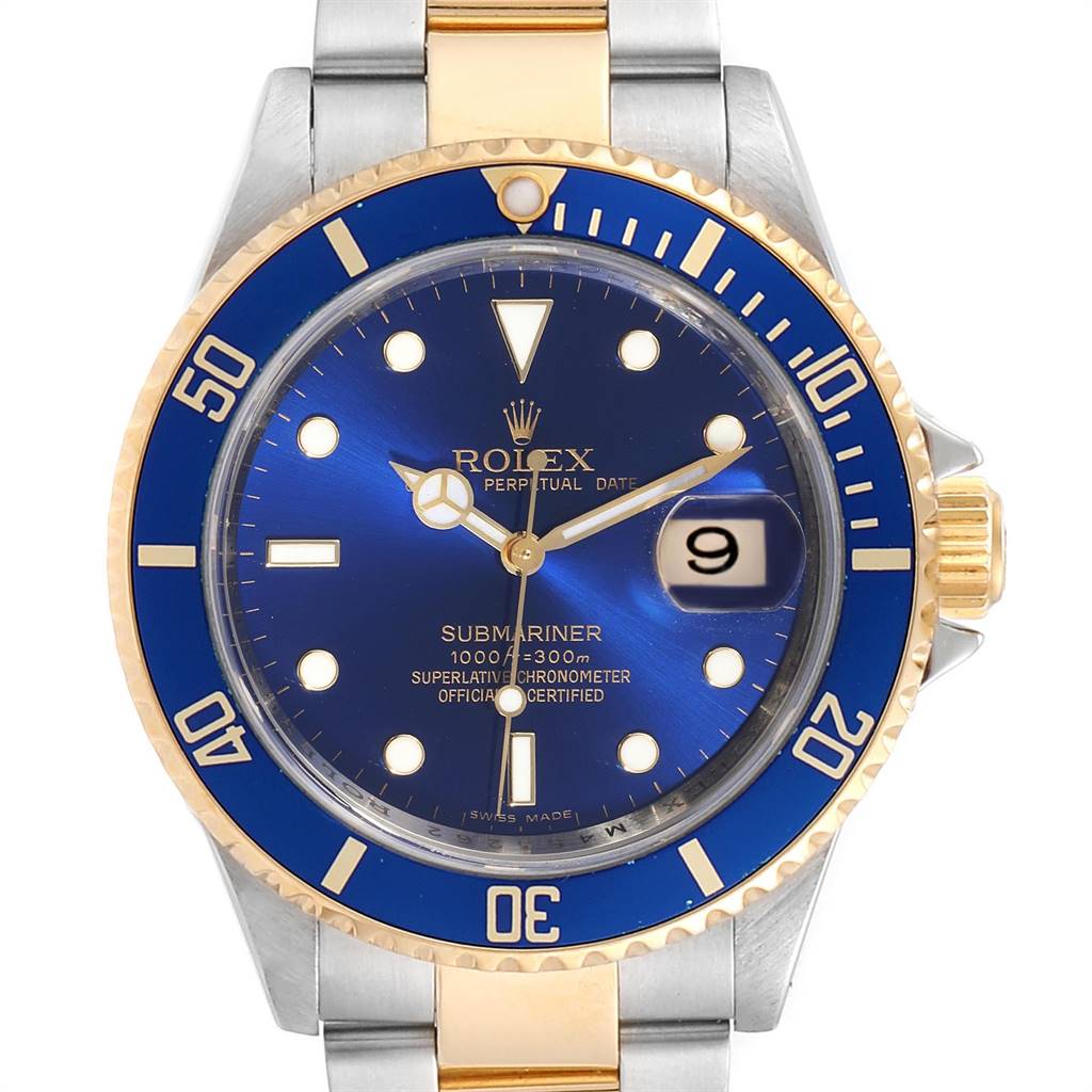 The image shows a frontal view of a Rolex Submariner 16613 Men
s Steel and Gold (two tone) Blue Dial 16613 Men
s Steel and Gold (two tone) Blue Dial watch, highlighting its blue dial, bezel, and date window.
