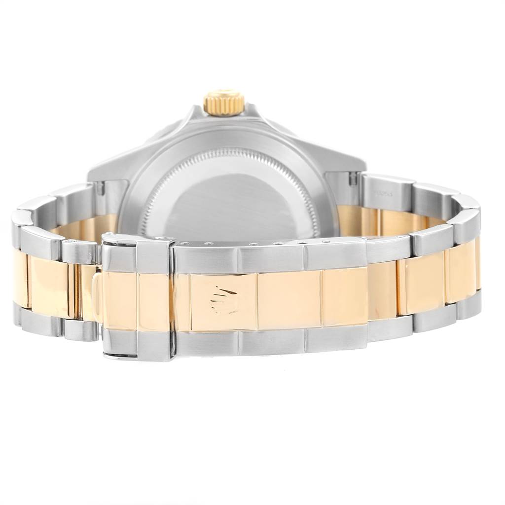 The image depicts the back view of a Rolex Submariner 16613 Men
s Steel and Gold (two tone) Blue Dial 16613 Men
s Steel and Gold (two tone) Blue Dial watch, showcasing its bracelet and case back.