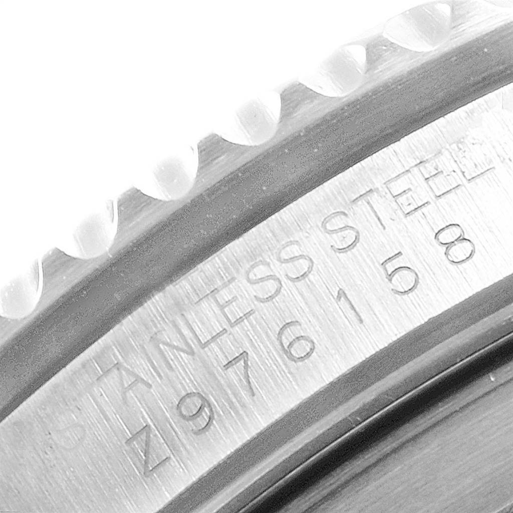 The image shows a close-up of the case side and serrated bezel edge of the Rolex Submariner 16610 Men
s Stainless Steel Black Dial 16610 Men
s Stainless Steel Black Dial watch, highlighting its stainless steel material.