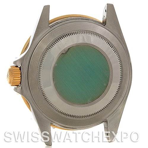 This image shows the case back and part of the crown of a Rolex Submariner 16613 Men's Yellow Gold Blue Dial 16613 Men's Yellow Gold Blue Dial model, viewed from the rear.