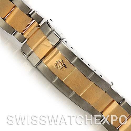 This image shows the clasp and part of the bracelet of a Rolex Submariner 16613 Men's Yellow Gold Blue Dial 16613 Men's Yellow Gold Blue Dial watch, featuring a combination of gold and stainless steel.