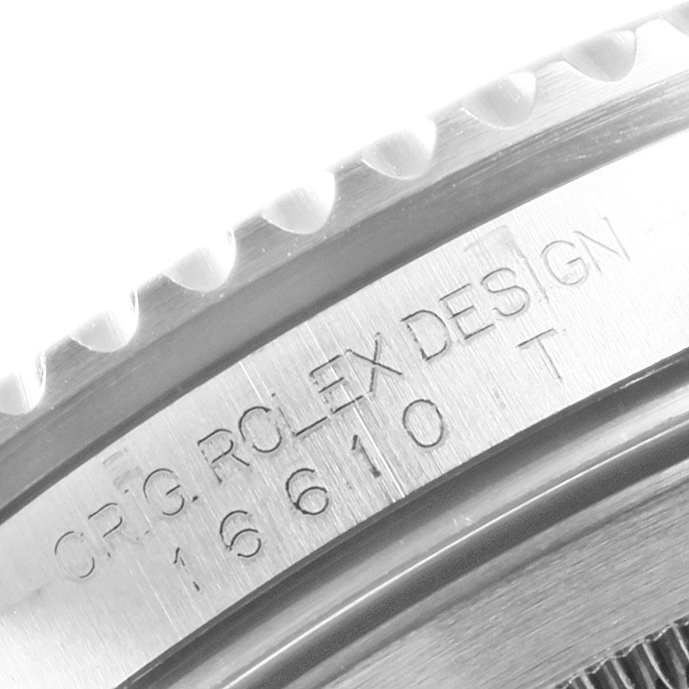 This image is a close-up of the case side of a Rolex Submariner 16610LV Men's Stainless Steel Black Dial 16610LV Men's Stainless Steel Black Dial, displaying the model number and design engraving.