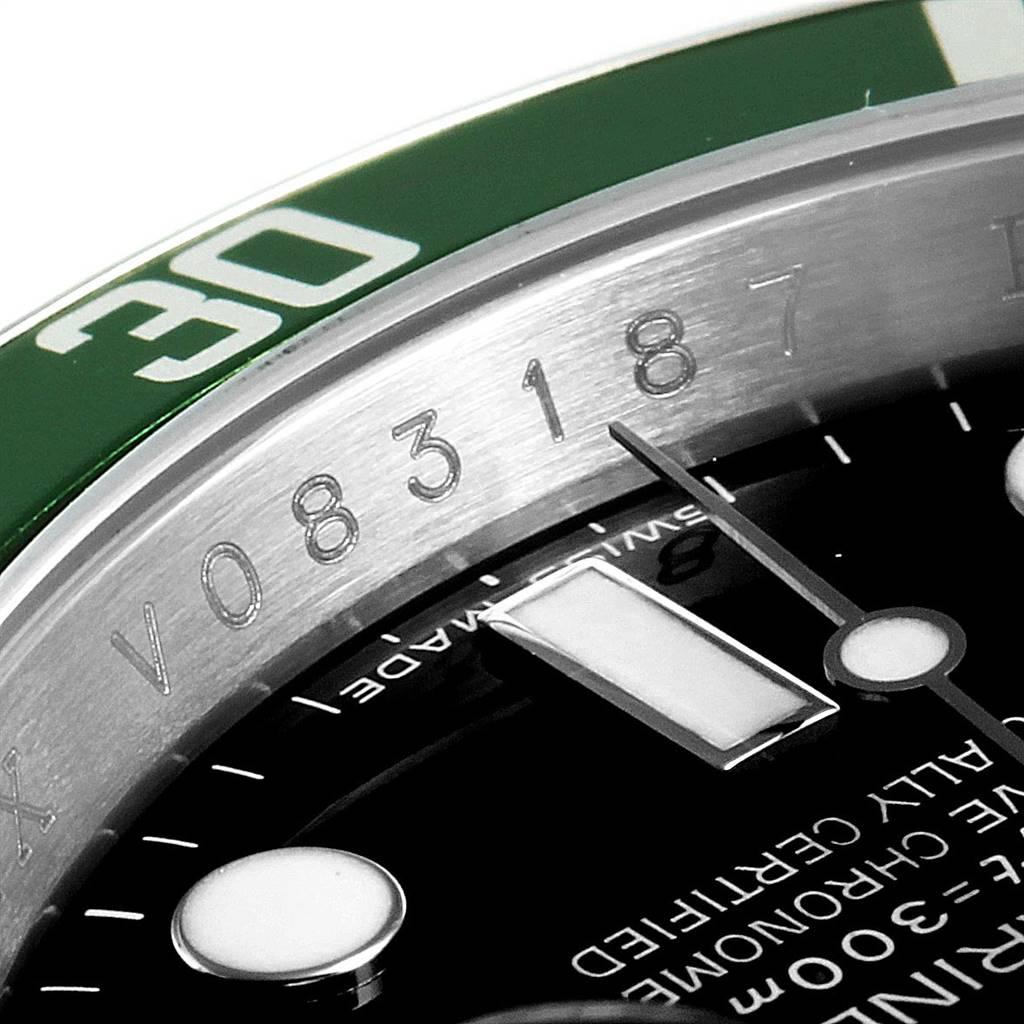 The image shows a close-up of the dial and bezel of a Rolex Submariner 16610LV Men's Stainless Steel Black Dial 16610LV Men's Stainless Steel Black Dial watch, highlighting the 30-minute marker and part of the serial number.