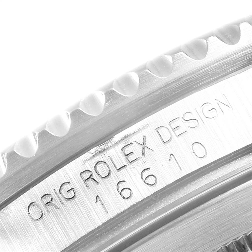 The image shows a close-up of the engraved side of a Rolex Submariner 16610 Men
s Stainless Steel Black Dial 16610 Men
s Stainless Steel Black Dial watch, highlighting the model number 16610.