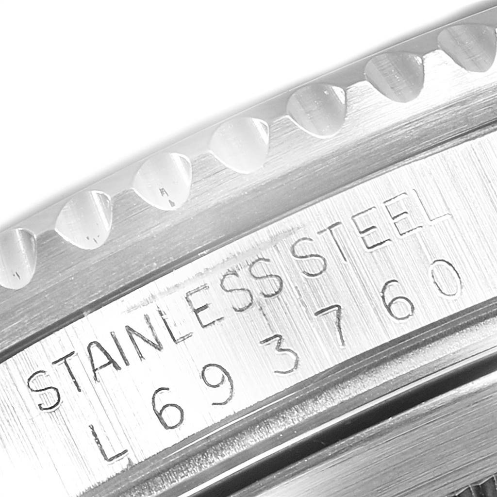 This image shows a close-up of the stainless steel case and reference number engraving on a Rolex Submariner 16610 Men
s Stainless Steel Black Dial 16610 Men
s Stainless Steel Black Dial watch.