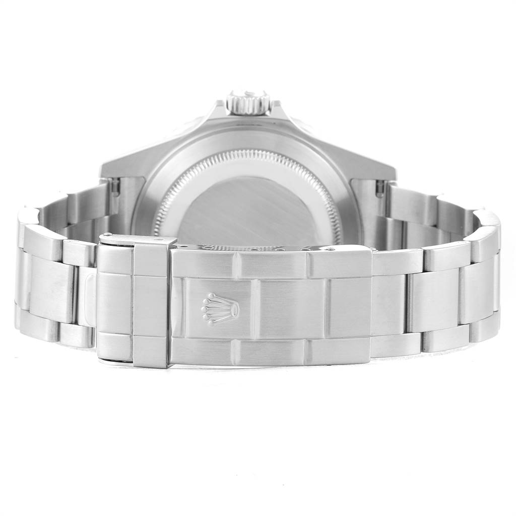 The image shows the back view of a Rolex Submariner 16610 Men
s Stainless Steel Black Dial 16610 Men
s Stainless Steel Black Dial watch, highlighting the case back and the metal bracelet with the Rolex clasp.