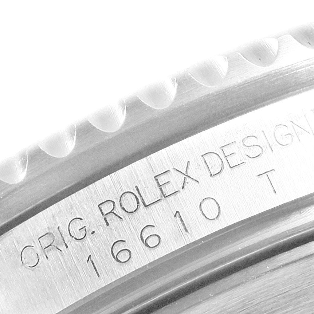 This image shows a close-up of the engraved markings on the side of a Rolex Submariner 16610 Men
s Stainless Steel Black Dial 16610 Men
s Stainless Steel Black Dial watch, model number 16610.