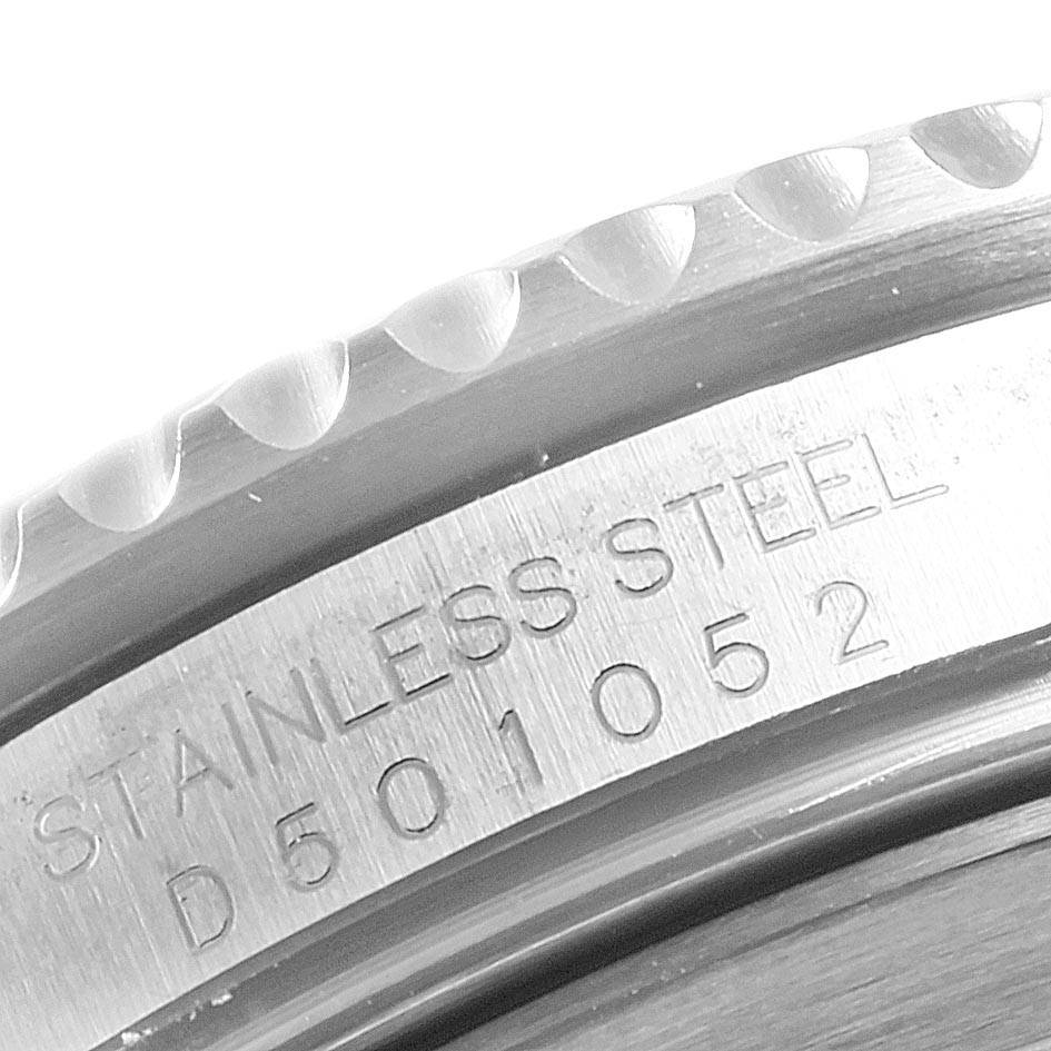 The image shows a close-up of the stainless steel bezel and serial number engraving of a Rolex Submariner 16610 Men
s Stainless Steel Black Dial 16610 Men
s Stainless Steel Black Dial watch.