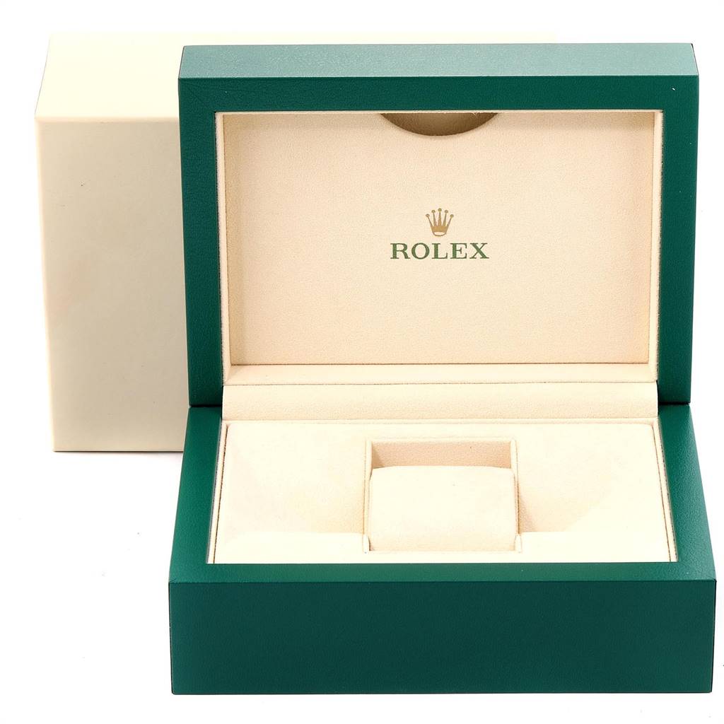 This image shows an open, empty Rolex Submariner 116613 Men's Steel and Gold (two tone) Black Dial 116613 Men's Steel and Gold (two tone) Black Dial watch box with green and beige outer and inner parts, respectively.