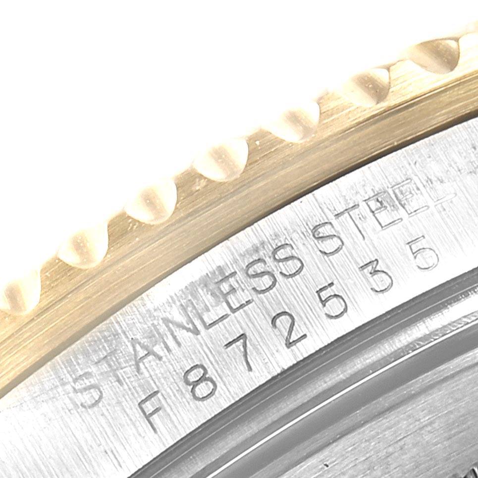 This close-up image of the Rolex Submariner 16613 Men
s Steel and Gold (two tone) Blue Dial 16613 Men
s Steel and Gold (two tone) Blue Dial watch shows its stainless steel case back and engraving details.