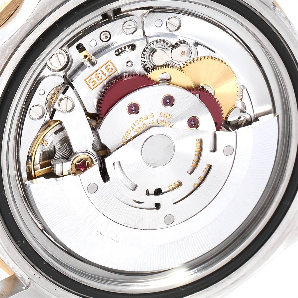 This image shows a close-up view of the internal mechanical movement of a Rolex Submariner 16613 Men
s Steel and Gold (two tone) Blue Dial 16613 Men
s Steel and Gold (two tone) Blue Dial watch.