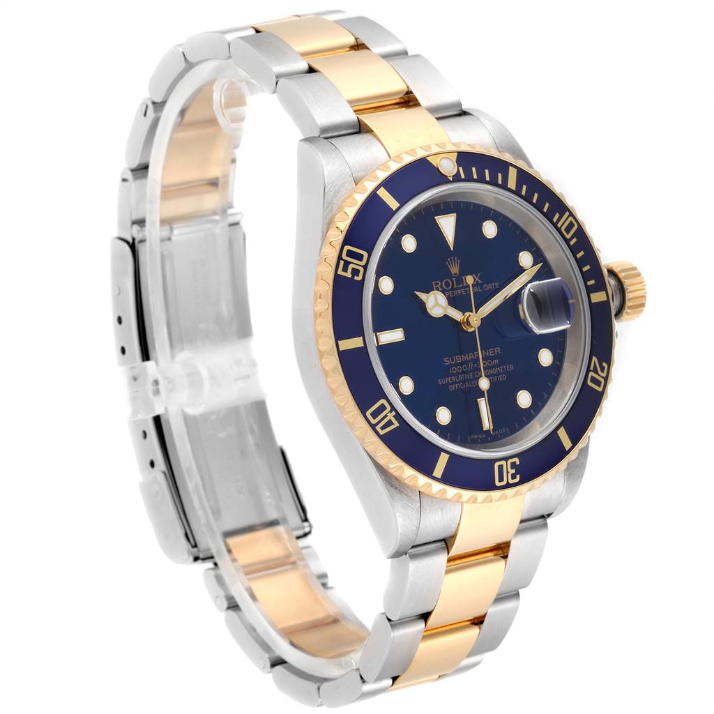 The image shows a Rolex Submariner 16613 Men
s Steel and Gold (two tone) Blue Dial 16613 Men
s Steel and Gold (two tone) Blue Dial watch at a three-quarter angle, highlighting its face, bezel, and bracelet.