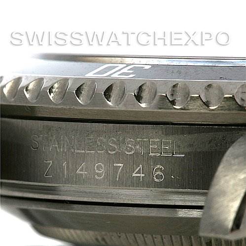 Close-up of the side view of a Rolex Submariner 16610 Men's Stainless Steel Black Dial 16610 Men's Stainless Steel Black Dial, showing the stainless steel casing and serial number.