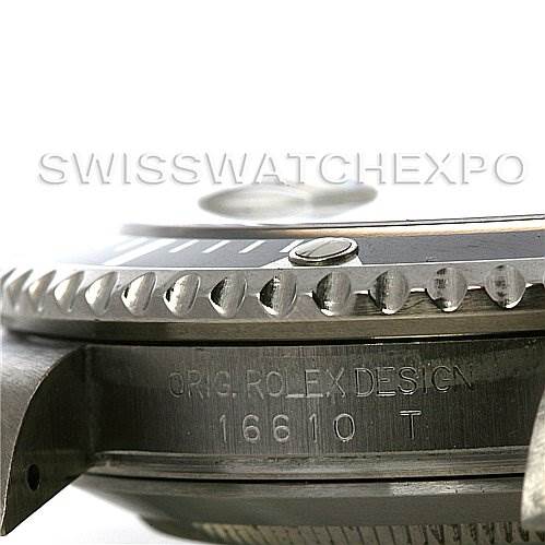 The image shows a close-up side view of the bezel and case of a Rolex Submariner 16610 Men's Stainless Steel Black Dial 16610 Men's Stainless Steel Black Dial, model 16610 T with the inscription visible.