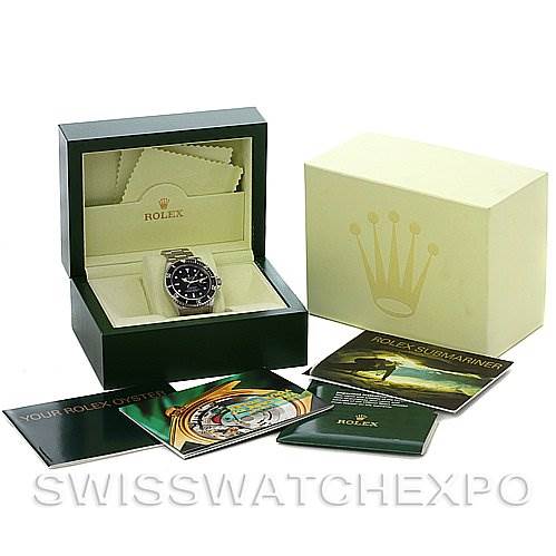 This image shows a Rolex Submariner 16610 Men's Stainless Steel Black Dial 16610 Men's Stainless Steel Black Dial watch in its box, alongside the outer box, booklets, and cleaning cloths.