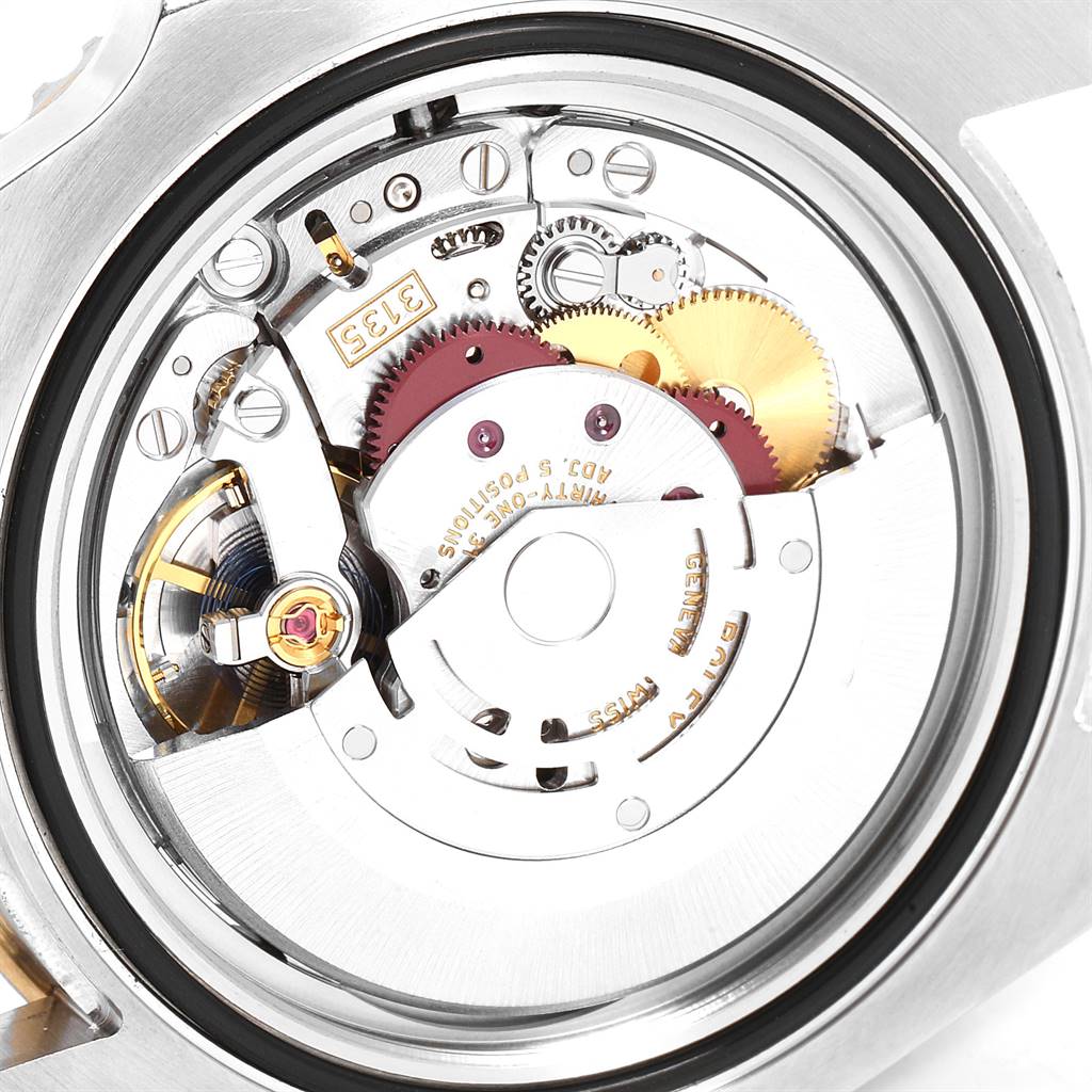 This image shows the internal mechanism and movement of a Rolex Submariner 116613 Men's Steel and Gold (two tone) Blue Dial 116613 Men's Steel and Gold (two tone) Blue Dial watch from the back view.