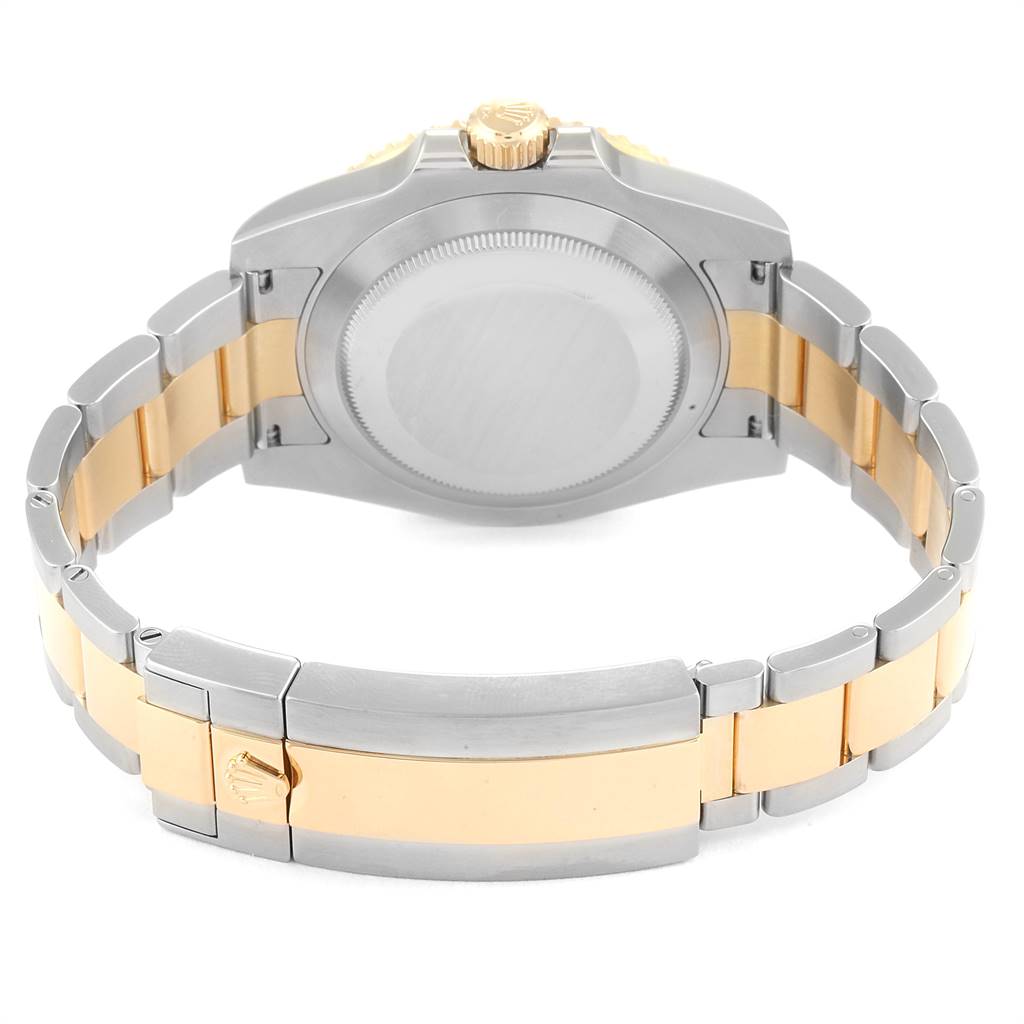 This image shows the back case and the bracelet of the Rolex Submariner 116613 Men's Steel and Gold (two tone) Blue Dial 116613 Men's Steel and Gold (two tone) Blue Dial watch, featuring a two-tone gold and silver design.