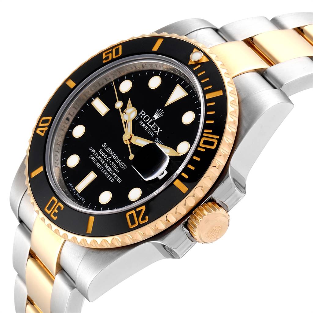 The image shows a Rolex Submariner 116613 Men
s Steel and Gold (two tone) Black Dial 116613 Men
s Steel and Gold (two tone) Black Dial watch angled to highlight its face, bezel, crown, and part of the two-tone bracelet.