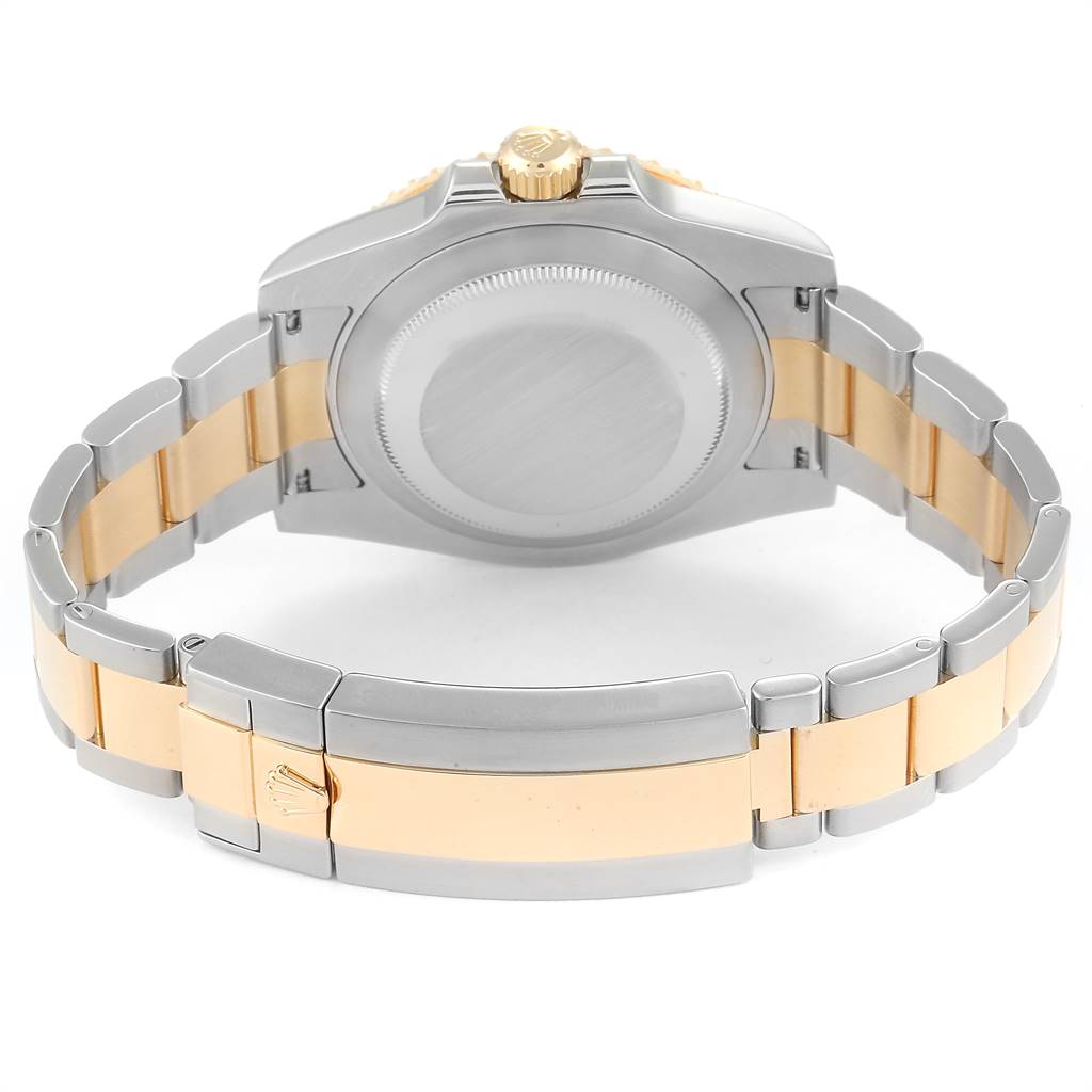This image displays the back case and two-tone bracelet of a Rolex Submariner 116613 Men
s Steel and Gold (two tone) Black Dial 116613 Men
s Steel and Gold (two tone) Black Dial watch, viewed from the rear angle.