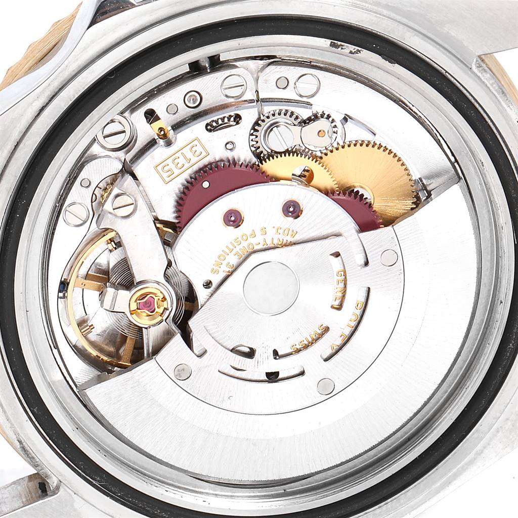 This image shows the internal movement mechanism of a Rolex Submariner 16613 Men's Steel and Gold (two tone) Champagne Dial 16613 Men's Steel and Gold (two tone) Champagne Dial watch from a close-up, back view.