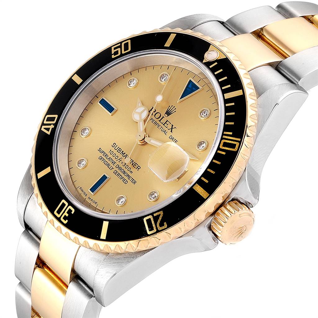 The image shows a Rolex Submariner 16613 Men's Steel and Gold (two tone) Champagne Dial 16613 Men's Steel and Gold (two tone) Champagne Dial watch at an angle highlighting the dial, bezel, crown, and part of the bracelet.