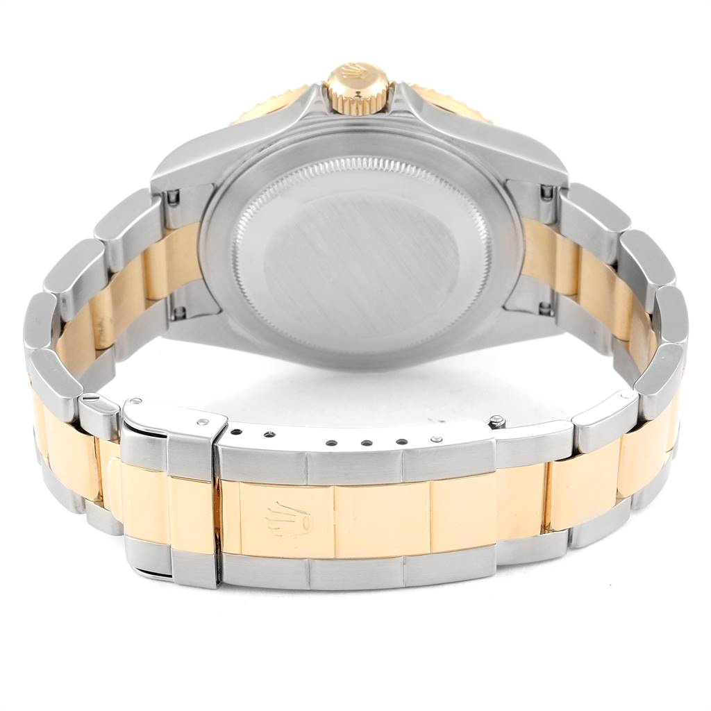 This image shows the back side and clasp of a Rolex Submariner 16613 Men's Steel and Gold (two tone) Champagne Dial 16613 Men's Steel and Gold (two tone) Champagne Dial watch, highlighting the two-tone bracelet and case.