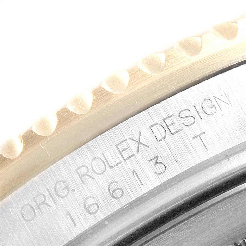 The image shows a close-up of the bezel and case side of a Rolex Submariner 16613 Men's Steel and Gold (two tone) Champagne Dial 16613 Men's Steel and Gold (two tone) Champagne Dial, highlighting the model number engraved on the side.