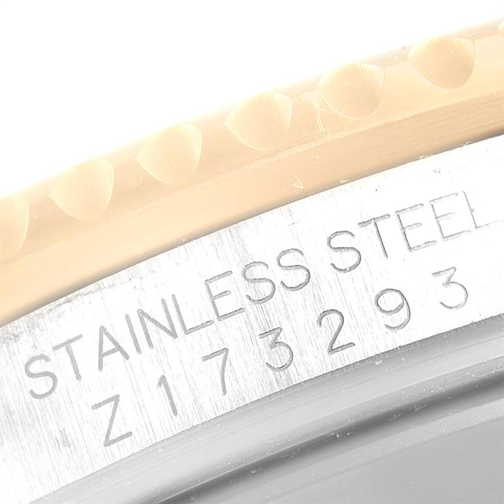 The image shows a close-up of the bezel and case with the serial number of a Rolex Submariner 16613 Men
s Steel and Gold (two tone) Grey Dial 16613 Men
s Steel and Gold (two tone) Grey Dial watch.