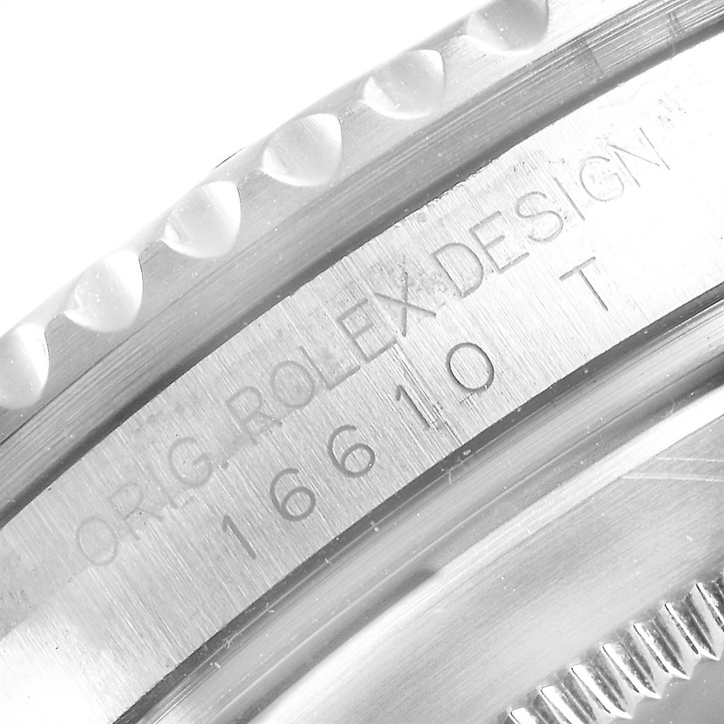 This is a close-up image of the side engraving on a Rolex Submariner 16610 Men
s Stainless Steel Black Dial 16610 Men
s Stainless Steel Black Dial, showing the "ORIG. ROLEX DESIGN" and the model number 16610.