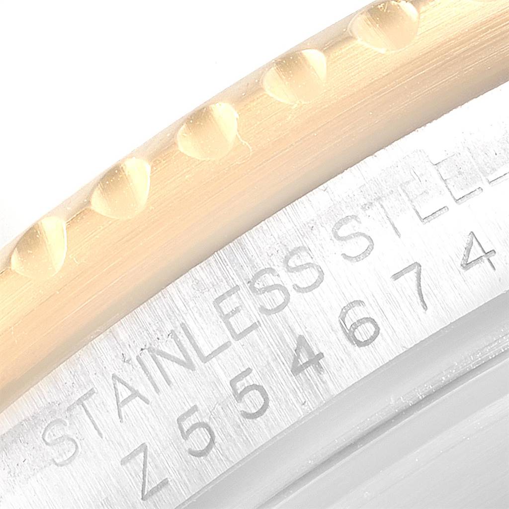 This image shows a close-up of the bezel edge and serial number of a Rolex Submariner 16613 Men
s Steel and Gold (two tone) Blue Dial 16613 Men
s Steel and Gold (two tone) Blue Dial watch.