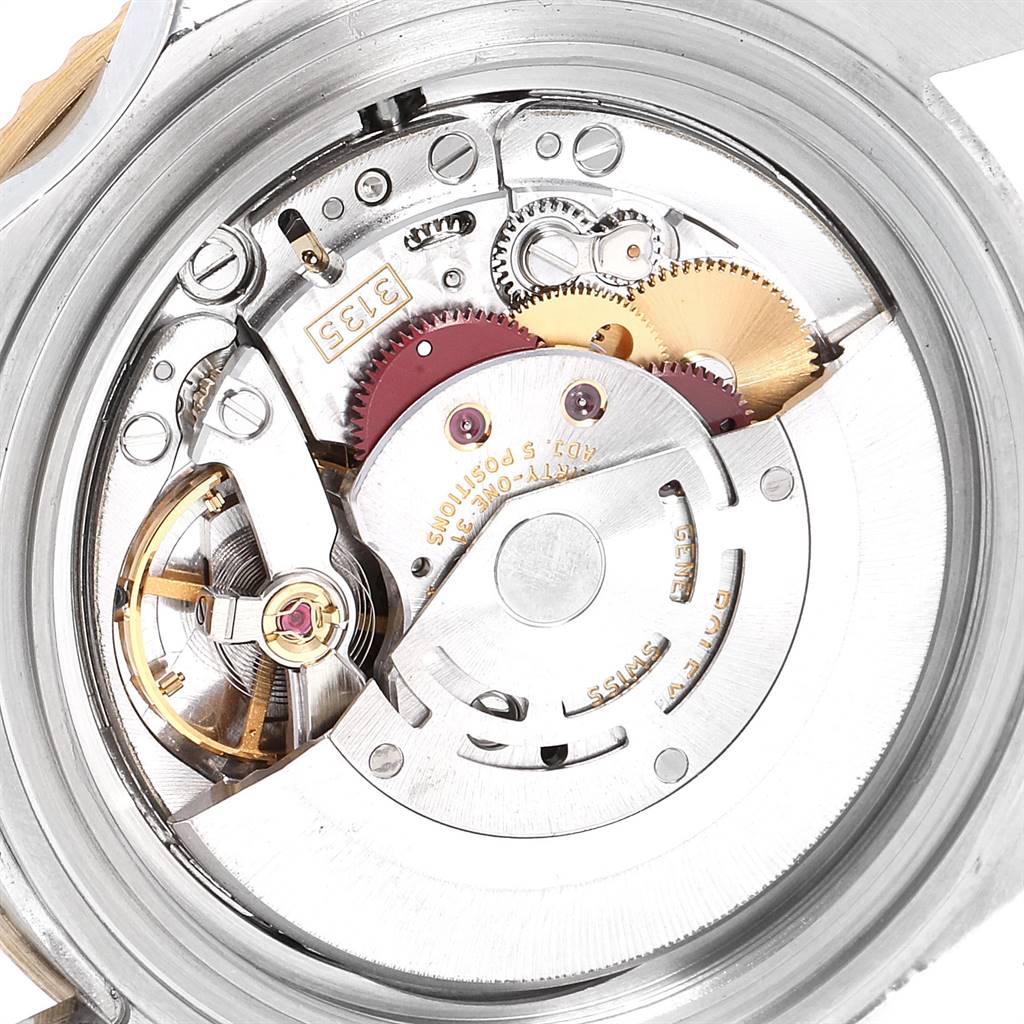 Shown is the open case back of a Rolex Submariner 16613 Men
s Steel and Gold (two tone) Blue Dial 16613 Men
s Steel and Gold (two tone) Blue Dial, revealing the intricate movement and internal gears.