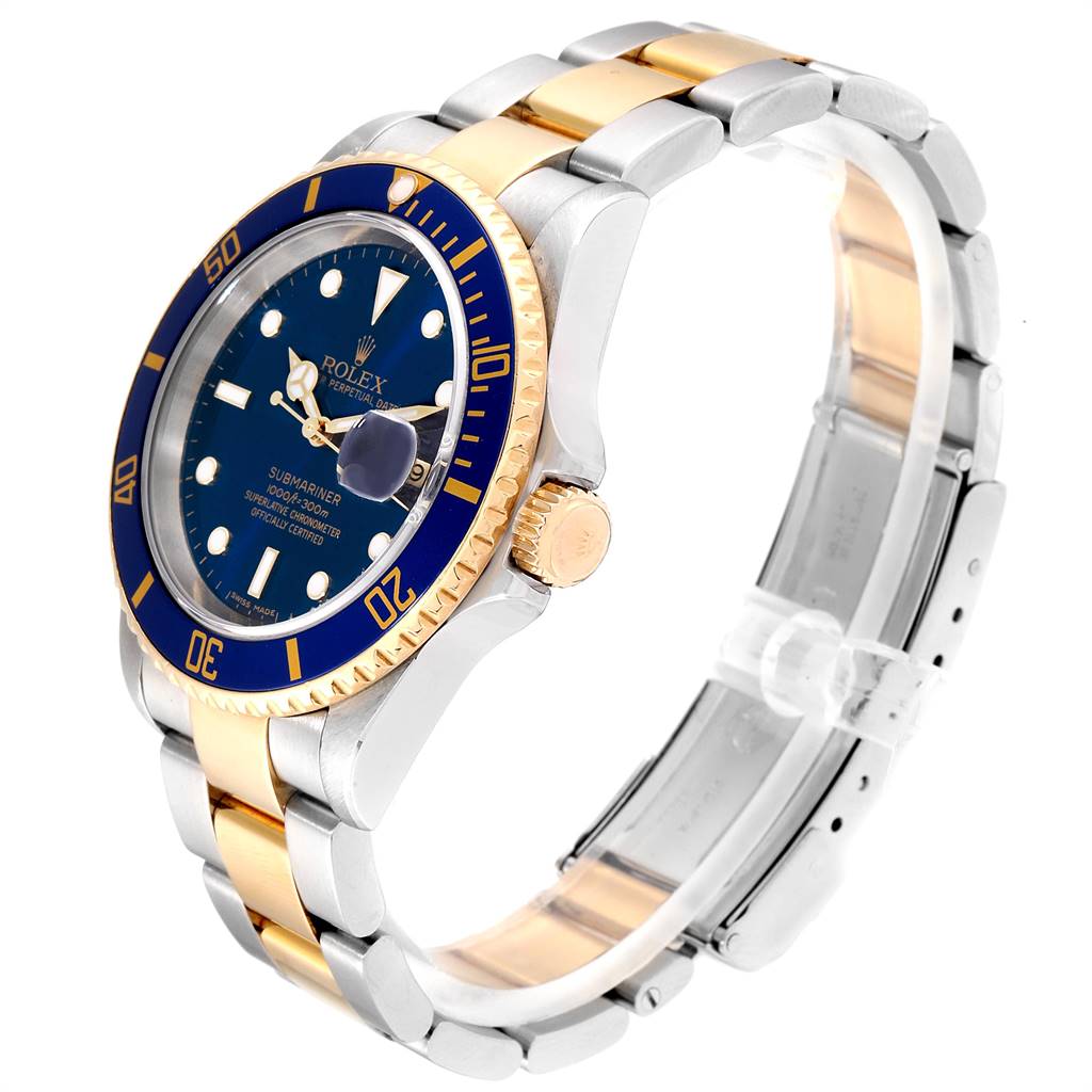 The Rolex Submariner 16613 Men
s Steel and Gold (two tone) Blue Dial 16613 Men
s Steel and Gold (two tone) Blue Dial watch is shown at a side angle, highlighting its blue dial, rotating bezel, and two-tone bracelet.