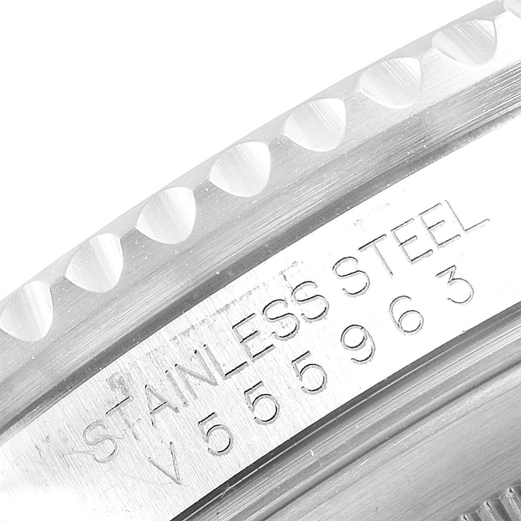 Close-up angle of the stainless steel case with serial number on a Rolex Submariner 16610 Men
s Stainless Steel Black Dial 16610 Men
s Stainless Steel Black Dial watch.