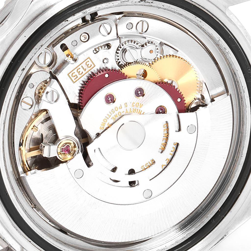 The image shows the internal mechanism of a Rolex Submariner 16610 Men
s Stainless Steel Black Dial 16610 Men
s Stainless Steel Black Dial watch viewed from the back.