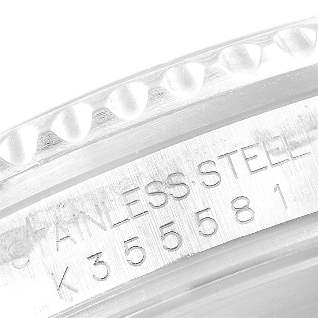 This image shows a close-up of the engraved serial number and stainless steel marking on the bezel of a Rolex Submariner 16610 Men
s Stainless Steel Black Dial 16610 Men
s Stainless Steel Black Dial watch.