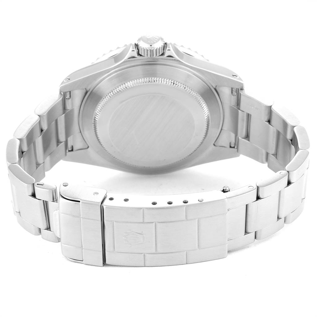 The image shows the backside and bracelet of a Rolex Submariner 16610 Men
s Stainless Steel Black Dial 16610 Men
s Stainless Steel Black Dial watch, highlighting its clasp and case back.