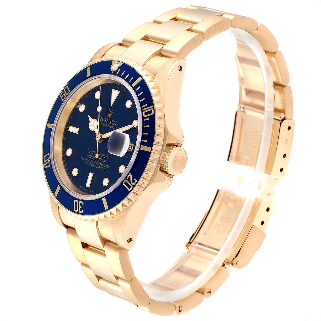 The image shows a side angle of a Rolex Submariner 16618 Men's Yellow Gold Blue Dial 16618 Men's Yellow Gold Blue Dial watch, highlighting its gold bracelet, blue bezel, and crown.