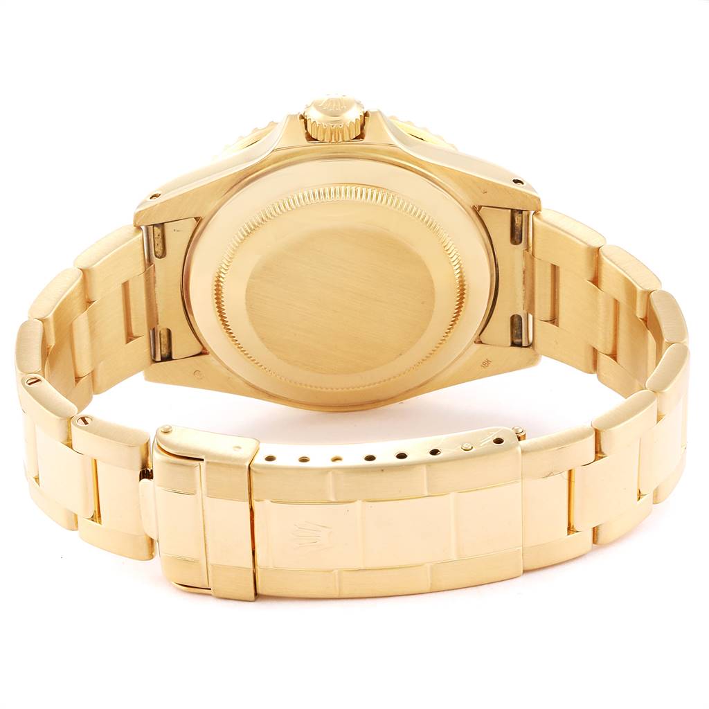 This image shows the back case and bracelet of a gold Rolex Submariner 16618 Men's Yellow Gold Blue Dial 16618 Men's Yellow Gold Blue Dial watch from a rear angle.