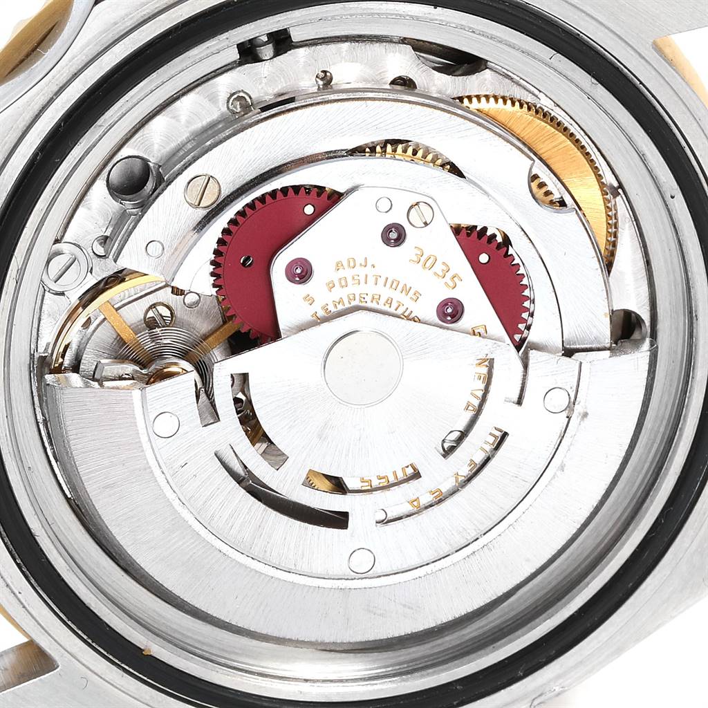 This image shows the internal mechanism of a Rolex Submariner 16803 Men
s Steel and Gold (two tone) Black Dial 16803 Men
s Steel and Gold (two tone) Black Dial watch, viewed from the back with the case removed.