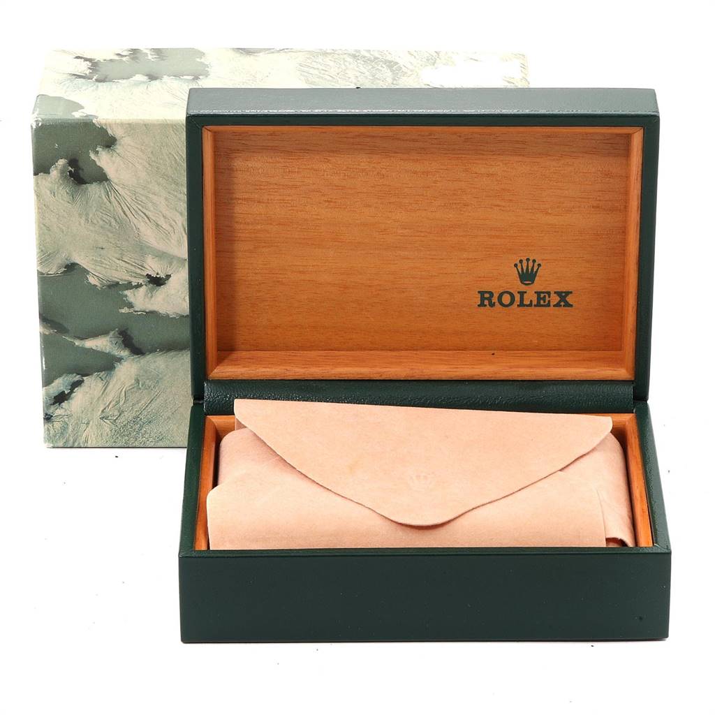 This image shows a Rolex Submariner 16803 Men
s Steel and Gold (two tone) Black Dial 16803 Men
s Steel and Gold (two tone) Black Dial watch box and outer packaging, with the watch covered in a pouch inside the box.